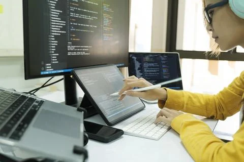 Programmer is coding and programming software. Stock Photos