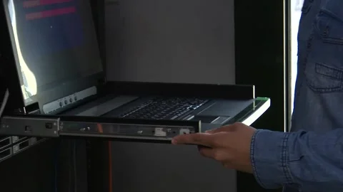 Programmer Coding on Computer Inside Server Room IT Development Scene Vídeo Stock 330103113