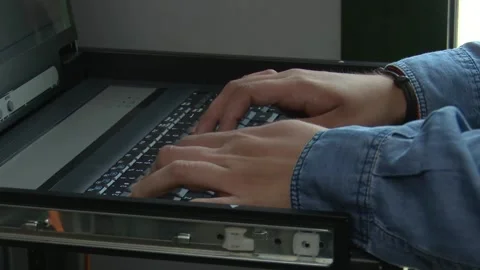 Programmer Coding on Computer Inside Server Room 库存影片 330103114