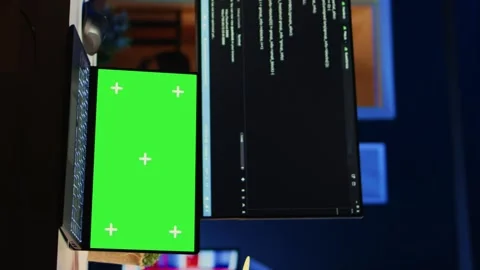 Programmer coding on computer next to isolated screen laptop in home office Stock Footage 265109438