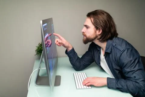 Programmer coding in the computer on office desk Stock Photos