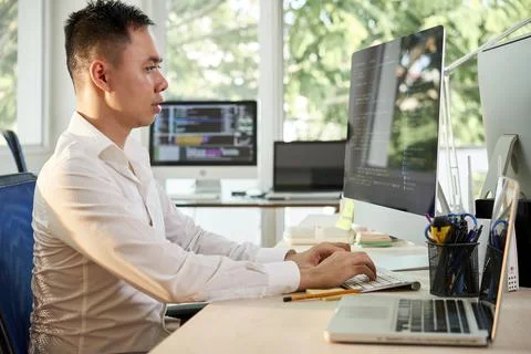 Programmer Coding on Computer Stock Photos