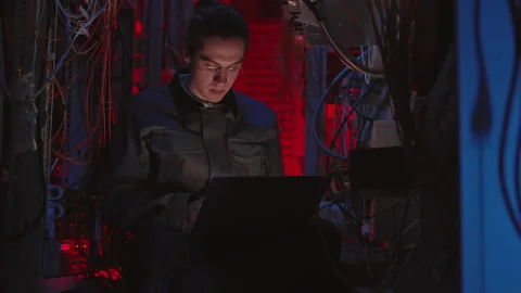 Programmer Coding in Dark Switchboard Ro... | Stock Video | Pond5
