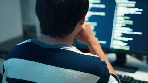 Programmer coding developer focused on software engineering systems interface Stock Footage 313808548