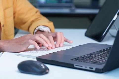 Programmer Coding on Laptop in Modern Technology Workspace Stock Photos