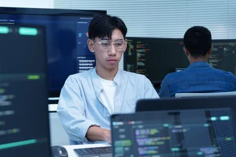 Programmer Coding Software with Digital Technology and AI Stock Photos