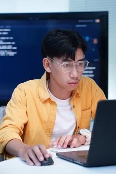 Programmer Coding Software on Laptop in Technology Workspace Stock Photos