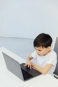 Programmer at a computer in a classroom at school at a laptop 写真素材