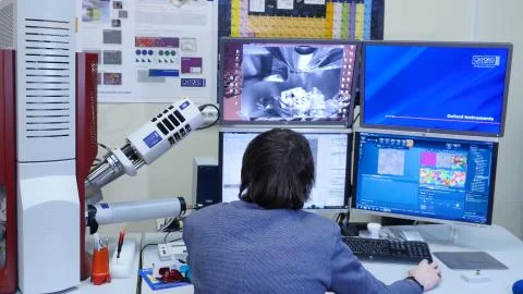 Programmer configures the computer for bitcoin mining. Programmers are watching Stock Photos