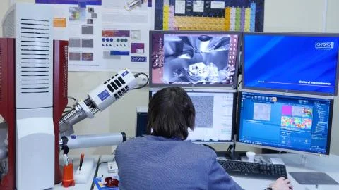 Programmer configures the computer for bitcoin mining. Programmers are watching 写真素材