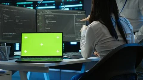 Programmer in data center maintaining databases using chroma key notebook 스톡 사진