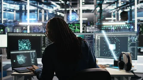 Programmer in data center using holographic simulation AI LLM VFX HUDs Stock Footage 323832103