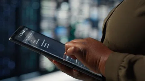 Programmer in data center using tablet to increase workload capacity 스톡 사진