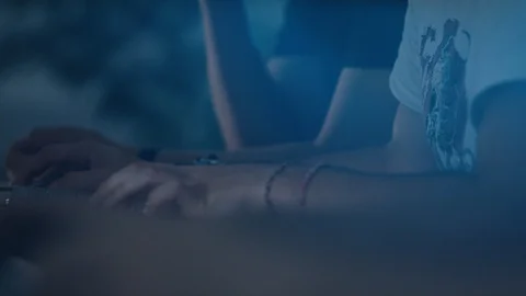 Programmer at desk typing on a keyboard and using a mouse Video stock 118221556