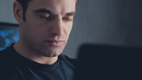 Programmer developer working on a computer at night in the office. Steadicam Stock Footage 102133963