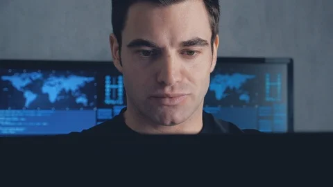 Programmer developer working on a computer at night in the office. Steadicam Stock Footage 102738902