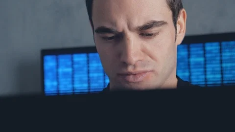 Programmer developer working on a computer at night in the office. Steadicam Stock Footage 102740344