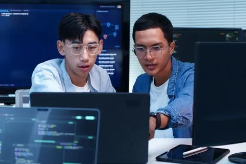 Programmer Developers Collaborating on AI Software Code Stock Photos
