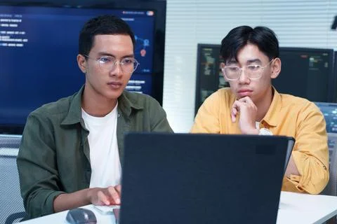 Programmer Developers Working on Software Code with Laptop Stock Photos