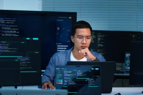 Programmer Developing AI Software and Digital Applications Stock Photos