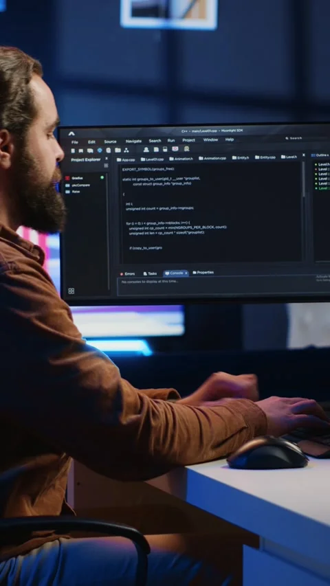 Programmer developing code on computer screen while in personal office Stock Footage 264512573