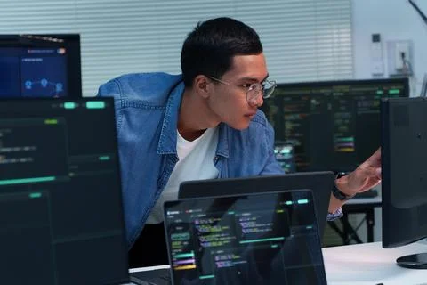 Programmer Developing Digital Code with Artificial Intelligence Stock Photos