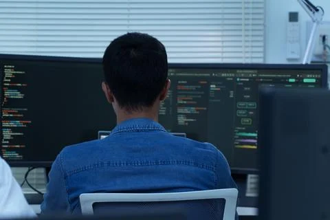 Programmer Developing Digital Software and AI Code Stock Photos