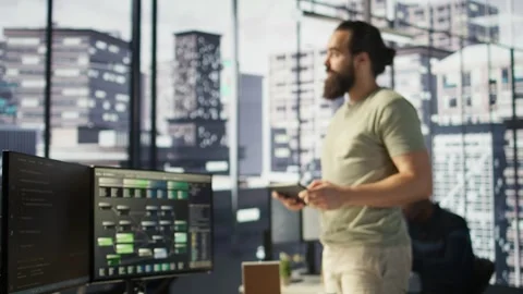 Programmer developing machine learning APIs, checking performance on tablet Stock Footage 318228711