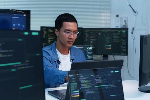 Programmer Developing Software with Artificial Intelligence Code 库存照片