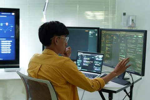 Programmer Developing Software with Artificial Intelligence Technology Stock Photos