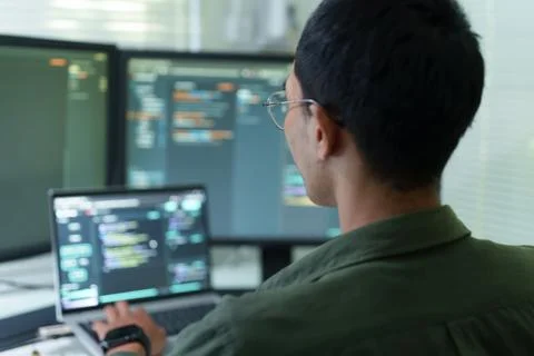 Programmer Developing Software Code with Artificial Intelligence Technology Stock Photos