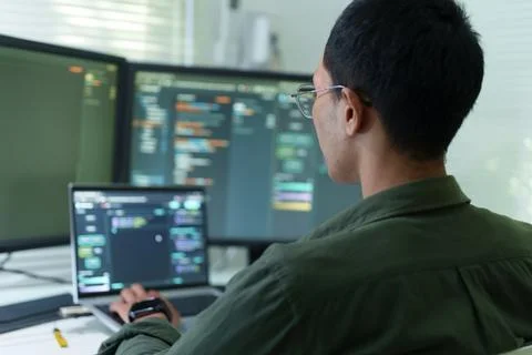 Programmer Developing Software Code with Artificial Intelligence Technology Stock Photos