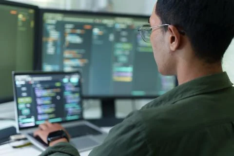 Programmer Developing Software Code for Artificial Intelligence Fotos Stock