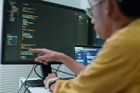 Programmer Developing Software Code with Artificial Intelligence Fotos Stock