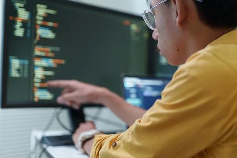 Programmer Developing Software Code with Artificial Intelligence Stock-Fotos
