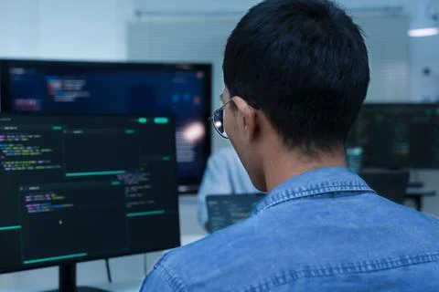 Programmer Developing Software Code with Digital Technology Stock Photos