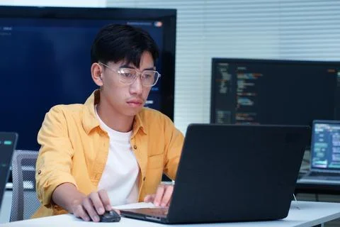 Programmer Developing Software Code with Laptop Stock Photos