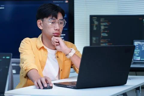 Programmer Developing Software with Laptop and Code Stock Photos