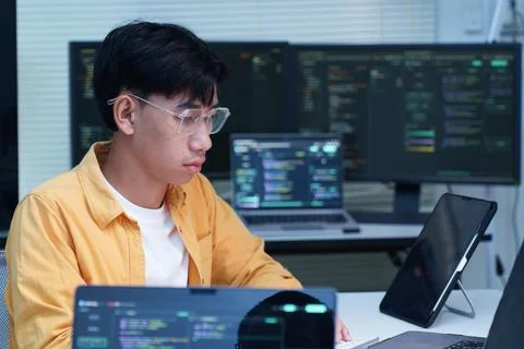 Programmer Developing Software with Multiple Computer Screens Stock Photos
