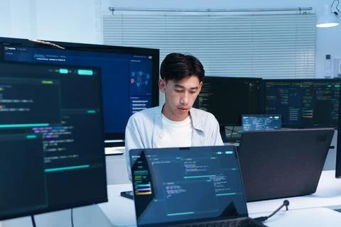 Programmer Developing Software with Multiple Screens Stock Photos
