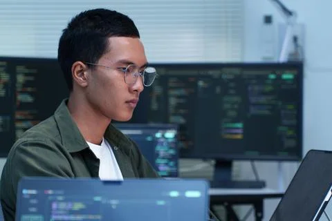 Programmer Developing Software Technology in Modern Workstation Stock Photos