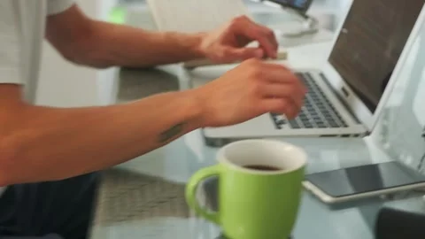 Programmer develops app using laptop and tablet, optimizing workflow. Stock Footage 294299202