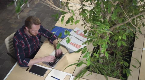 Programmer dials the code and thinks how to solve the problem. Stock Footage 60451383