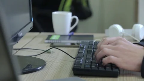 Programmer dials on his black keyboard the computer Stock Footage 75315681