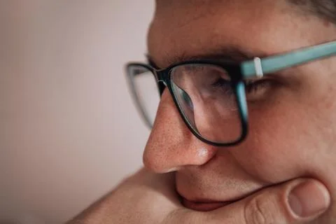 A programmer diligently testing smartphone applications while sitting in their 스톡 사진