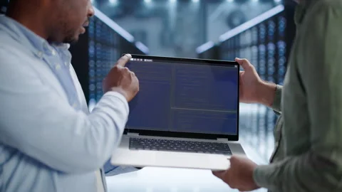 Programmer Discusses Code Security While Working On Laptop Stock Footage 346321775