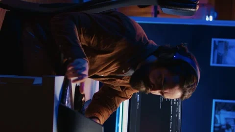 Programmer does multitasking, drinks coffee, listens music Stock Footage 265109102