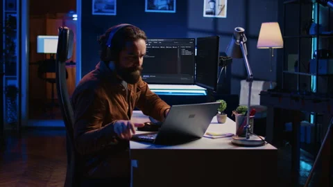 Programmer does multitasking, drinks coffee, listens music Stock Footage 265513452