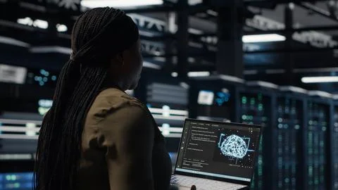 Programmer doing data center automation using AI software tools Stock Photos