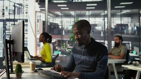 Programmer doing software debugging, asking for help from smiling team leader Video stock 318161676